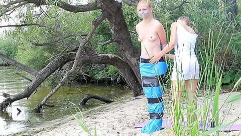Girl Tied And Gagged In Trashbags On The Beach